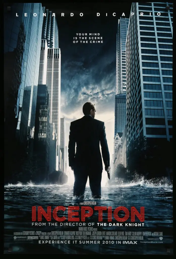 Movie poster for 'Inception', featuring a man in a suit standing in a flooded urban environment, with skyscrapers in the background. The title 'Inception' and credits are displayed prominently.